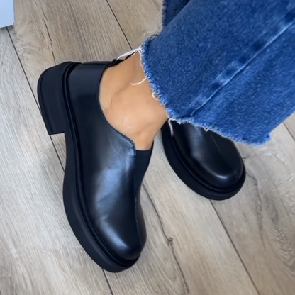 Women's black leather loafers